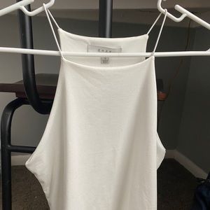 White halter tank with thin straps.